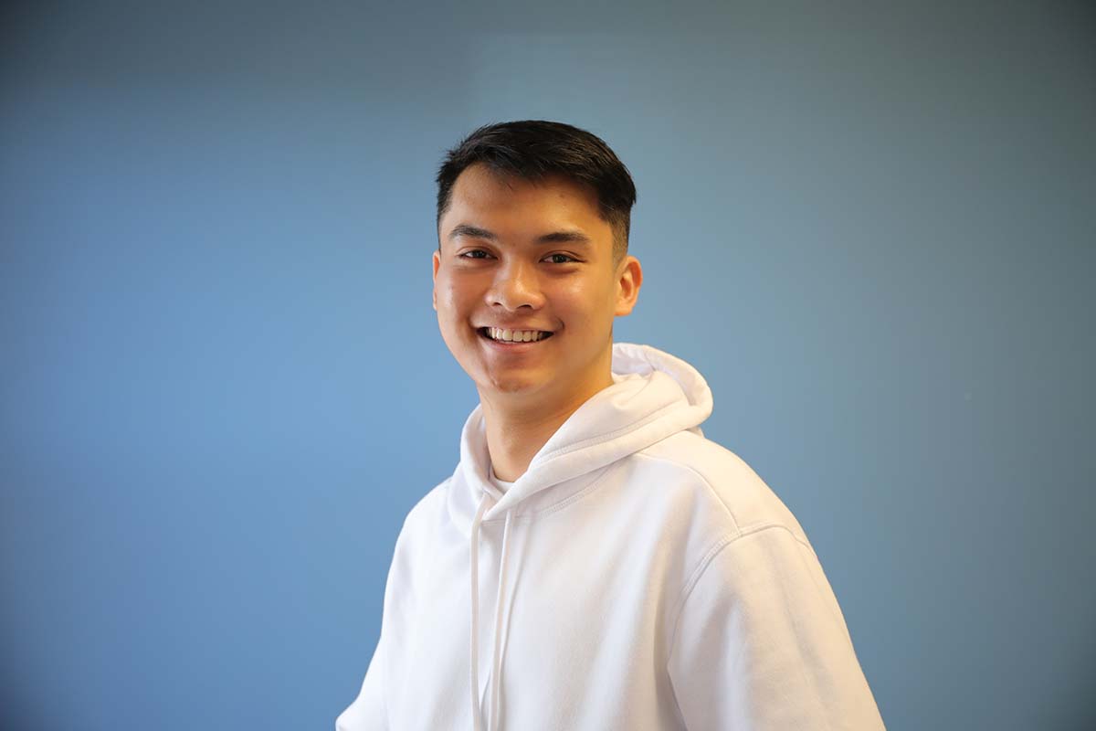 Friendly student smiling at a university in Australia