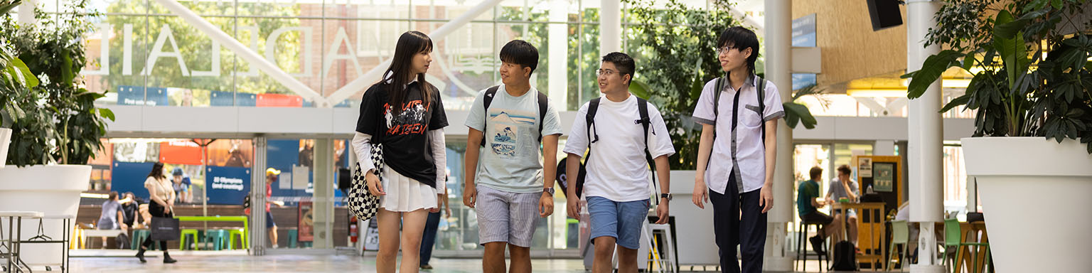 Header image with students walking through plaza